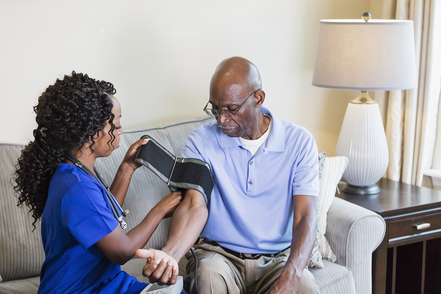 Nurse visiting patient for an in-home clinical trial visit